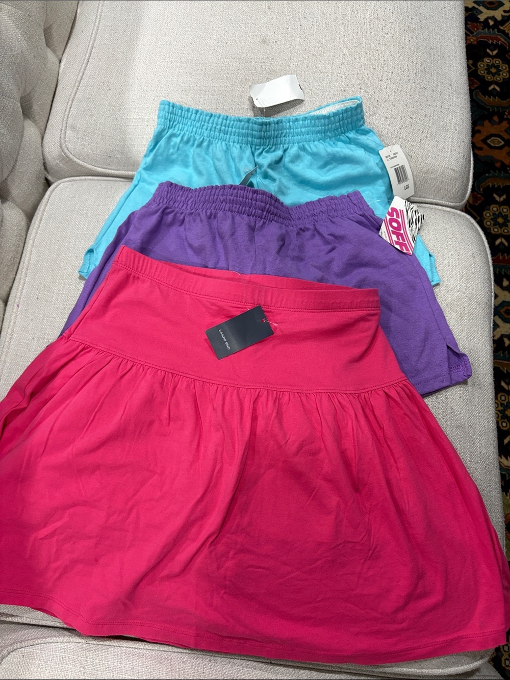 Different brands, two shorts and a skirt with shorts.